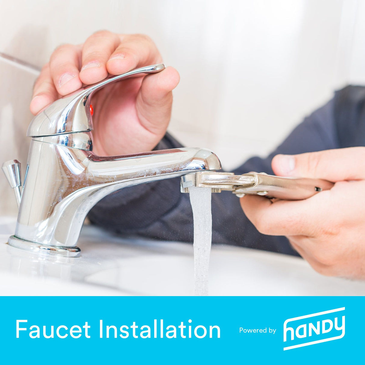 Handy technician installing faucet